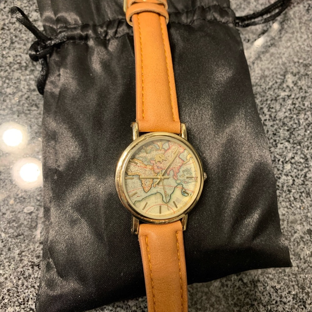 Brown leather watch w globe face